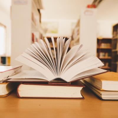 Book Library With Old Open Textbook Stack Piles Literature Text Archive Reading Desk
